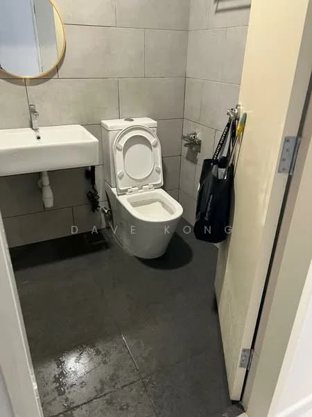 Bathroom features: wall-mounted sink, round mirror, one-piece toilet, grey tiled walls, dark tile flooring, toilet paper holder, hand towel holder, wall-mounted faucet; style: modern.
