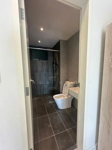 Bathroom features: grey tiled flooring, white toilet, walk-in shower with glass enclosure, chrome shower head, wall-mounted shower controls, grey wall tiles, recessed lighting, mirror above sink, white sink, vanity with storage; style: modern.