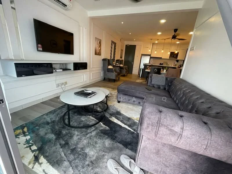 Living features: 3-seater grey tufted sofa, round coffee table with black base, area rug with abstract pattern, wall-mounted flat-screen TV, white entertainment unit, recessed downlights, ceiling fan, light grey walls, laminate flooring, decorative wall art, two accent chairs, open layout to kitchen; style: modern.