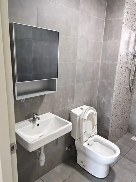 Bathroom features: grey tiled walls, grey tiled flooring, single-sink vanity with wall-mounted mirror, chrome basin mixer faucet, one-piece toilet, shower with wall-mounted faucet, exposed plumbing, built-in shelf above sink; style: modern.
