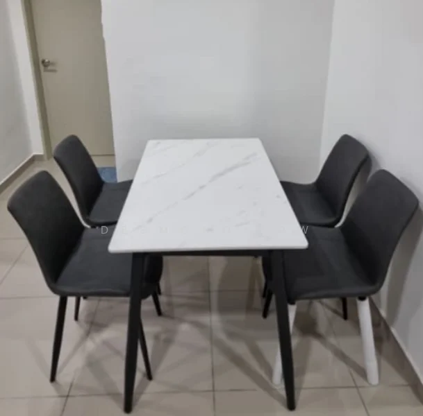 Dining features: marble dining table with white and grey veining, 4 upholstered dining chairs in grey, black wooden legs on table, white leg on one chair, tile flooring, plain white walls, doorway visible in background; style: modern.