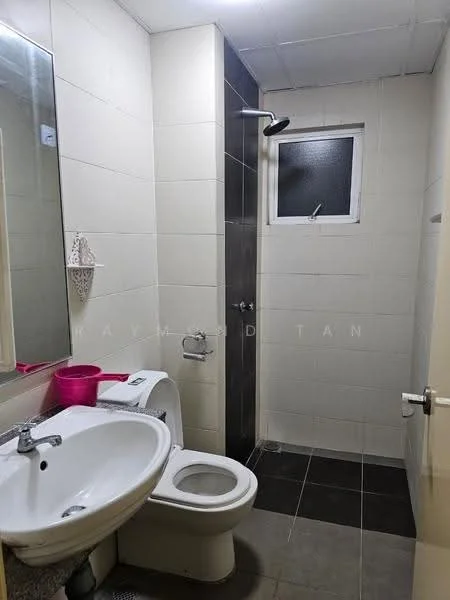 Bathroom features: white ceramic toilet, single-sink vanity with chrome faucet, mirror above sink, shower area with glass partition, handheld shower head, white tiled walls, dark grey floor tiles, window in shower area; style: modern.