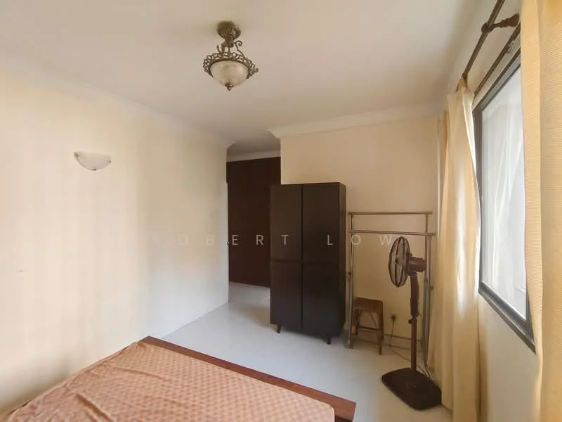 Bedroom features: cream painted walls, white ceiling, recessed downlights, window with sheer curtains, floor-to-ceiling window, laminate flooring, queen-size bed with patterned bedspread, wooden wardrobe, wooden chair, standing fan.