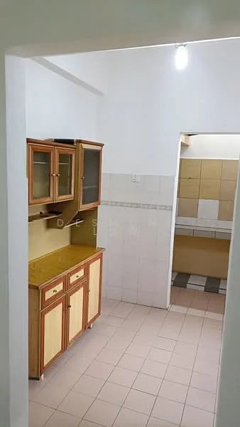 Kitchen features: wooden cabinetry with glass doors, yellow laminate countertop, white tiled walls, pink tiled flooring, single-basin sink, overhead lighting, open layout to adjacent area, built-in countertop space.