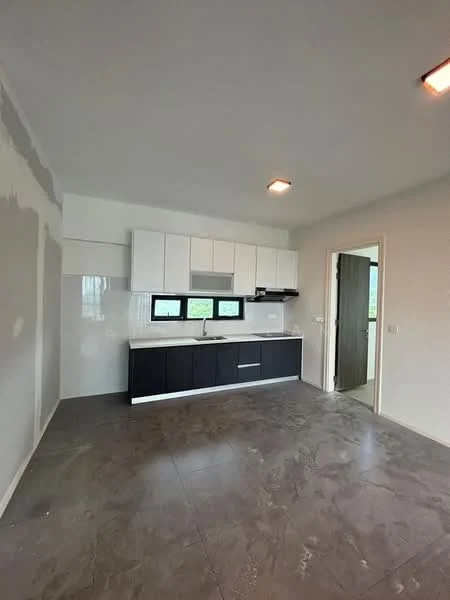 Kitchen features: black cabinetry, white upper cabinets, stainless-steel sink, chrome pull-down faucet, white tiled backsplash, grey floor tiles, built-in oven, stove with hood, three windows, open layout; style: modern.