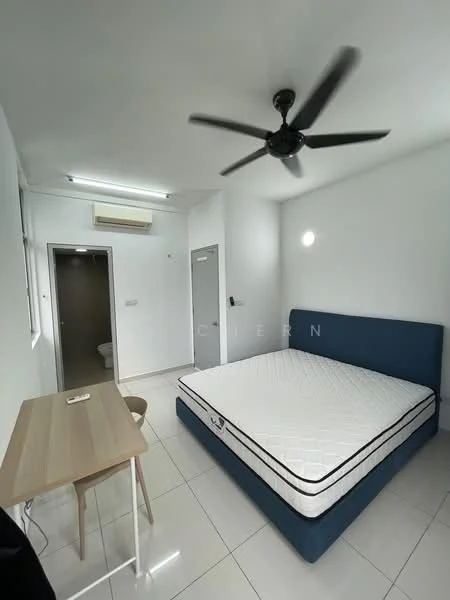 Bedroom features: king-size bed with blue upholstered frame, white mattress, ceiling fan with 5 blades, white painted walls, glossy tile flooring, study desk in light wood, wooden chair, air conditioning unit, door leading to bathroom, window with natural light; style: modern.