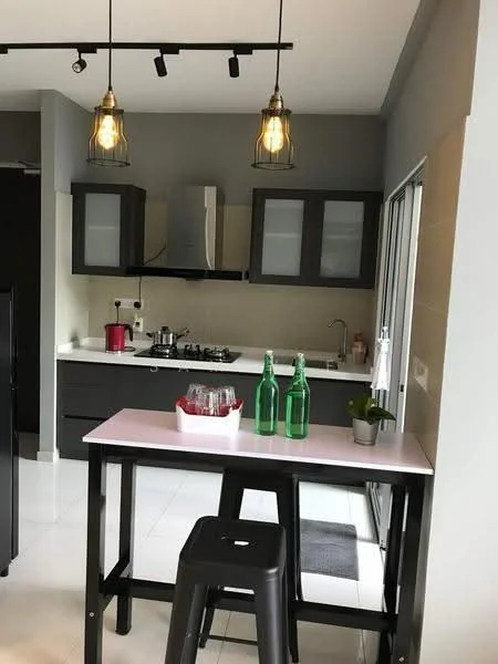 Kitchen features: grey cabinetry with glass-front upper cabinets, white countertop, stainless-steel sink, chrome pull-down faucet, 4-burner gas hob, built-in stainless-steel oven, refrigerator, pendant lighting, white tiled backsplash, black bar table, black stool, green glass bottles, houseplant in ceramic pot, sliding glass door; style: modern.