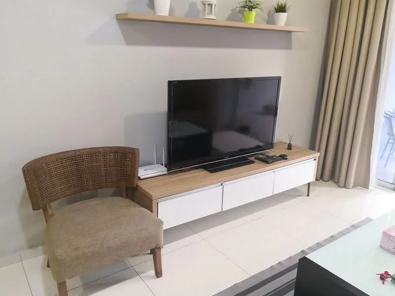 Living features: flat-screen TV on media console, wooden media console with white drawers, beige upholstered chair, light grey walls, white tiled flooring, shelf with decorative items, curtains, area rug with stripes; style: modern.