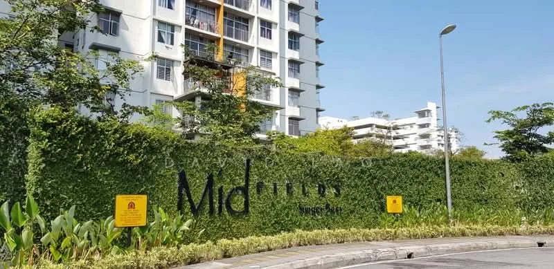 Exterior type: mid-rise condominium; features: greenery-covered wall, landscaped garden, paved walkway, multiple-storey building, balconies visible, signage with name 'Mid Fields', street lighting, surrounding trees; style: modern.