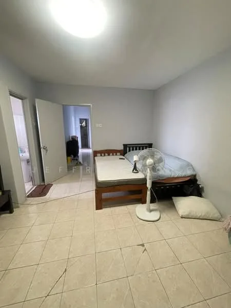 Bedroom features: single bed with mattress, wooden bed frame, floor fan, tile flooring, light grey painted walls, window with no visible treatment, white ceiling, door leading to bathroom, pillow on the floor, blanket on the bed.