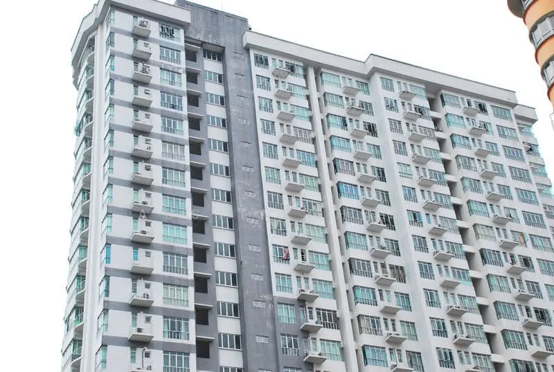 Exterior type: high-rise condominium; features: glass curtain wall, white painted facade, balconies with glass railings, multiple wall-mounted split AC units, approximately 15-storey high-rise, grey accent wall, windows with white frames, projecting balconies; style: modern.
