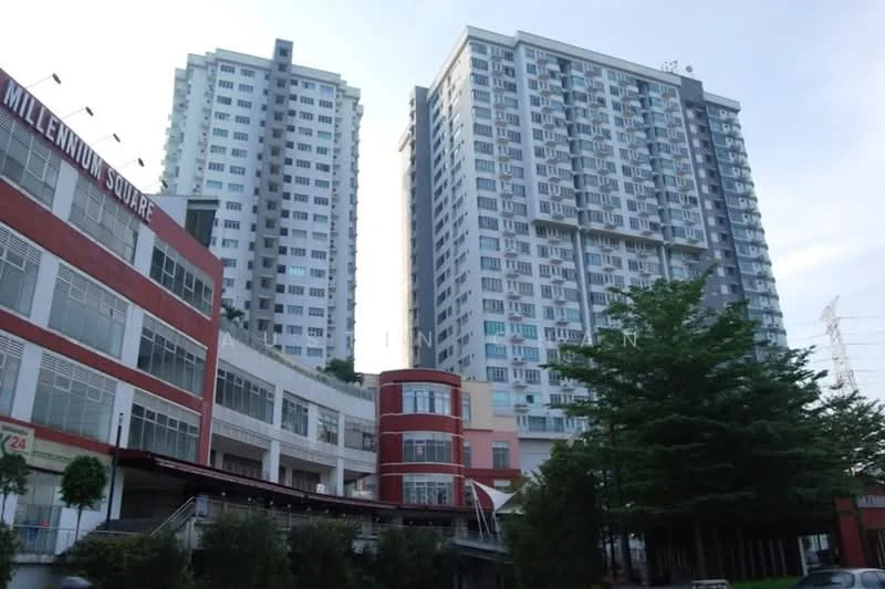 Exterior type: high-rise condominium; features: glass curtain wall, red brick facade, multiple storeys, surrounded by greenery, balconies on upper floors, commercial space at ground level, landscaped area with trees; style: modern.