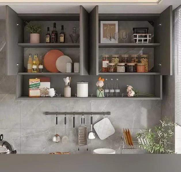 Kitchen features: grey cabinetry with open shelving, glass jars with contents, bottles of beverages, decorative plates, kitchen utensils hanging on a rack, ceramic figurine, wall-mounted storage for kitchen tools, marble countertop, grey tile backsplash, under-cabinet lighting; style: modern.