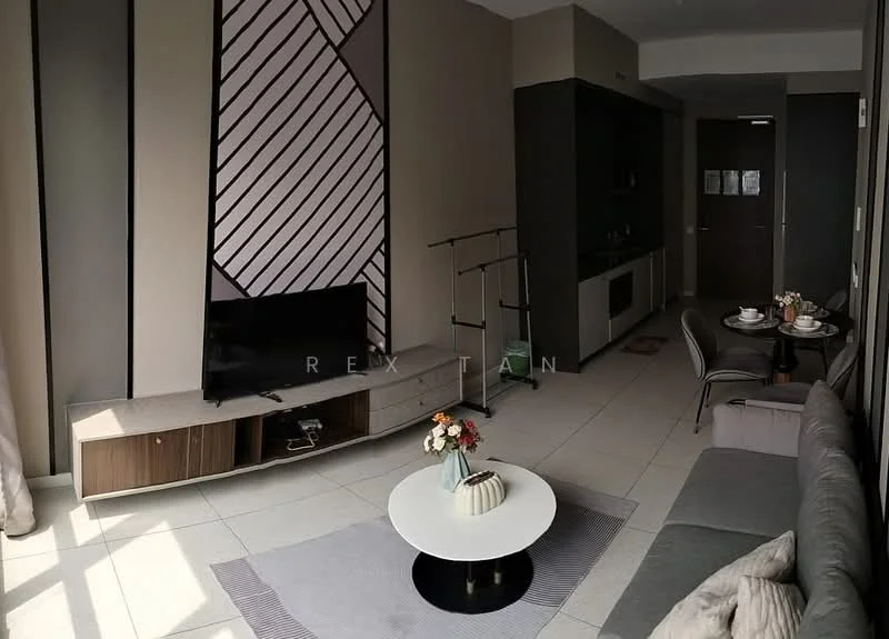 Living features: grey fabric sofa, round coffee table, TV console with wooden cabinetry, wall-mounted TV, decorative wall with geometric pattern, dining table for two, chairs, floor-to-ceiling windows, light-colored tiled flooring, decorative vase with flowers, area rug with geometric pattern; style: modern.