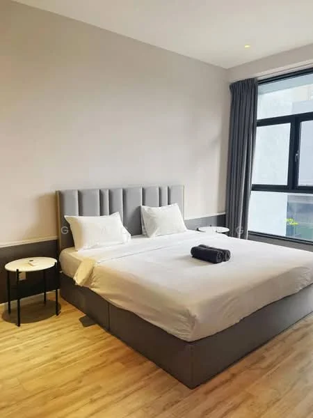 Bedroom features: king-size bed with grey upholstered headboard, white bedding, two bedside tables with black legs, laminate wood flooring, floor-to-ceiling window, grey curtains, decorative towel on bed, wall-mounted light fixture; style: modern.
