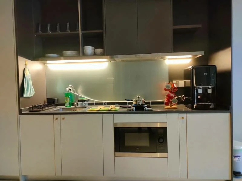 Kitchen features: grey cabinetry, black countertop, stainless-steel sink, chrome pull-down faucet, built-in microwave, freestanding range oven, glass splashback, kitchen utensils on shelf, green dish towel, decorative figurine, bottle of cleaning solution, green dish drying mat; style: modern.