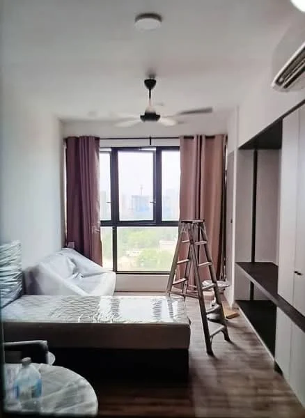 Bedroom features: floor-to-ceiling windows, brown wooden flooring, 5-blade ceiling fan, white walls, curtains in beige, queen-size bed, upholstered headboard, sofa, ladder, built-in wardrobe, decorative wall shelf; style: modern; view: city.