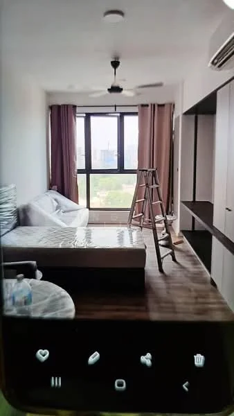 Room features: wooden flooring, large floor-to-ceiling windows, sheer curtains, 5-blade ceiling fan, wall-mounted air conditioning unit, light-colored walls, built-in wardrobe, ladder, unmade bed with mattress, round dining table, bottled water on table; style: modern; view: city.