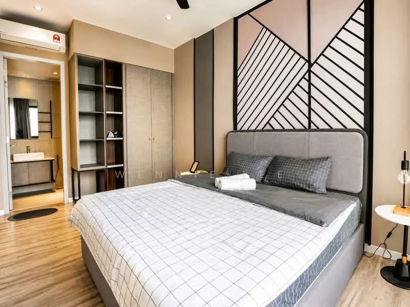 Bedroom features: king-size bed with grey upholstered headboard, grey bedding with white grid pattern, two grey pillows, wooden bedside table with lamp, decorative wall with geometric pattern, light brown painted walls, laminate flooring, built-in wardrobe with sliding doors, open shelving unit, floor-to-ceiling mirror, black ceiling fan; style: modern.