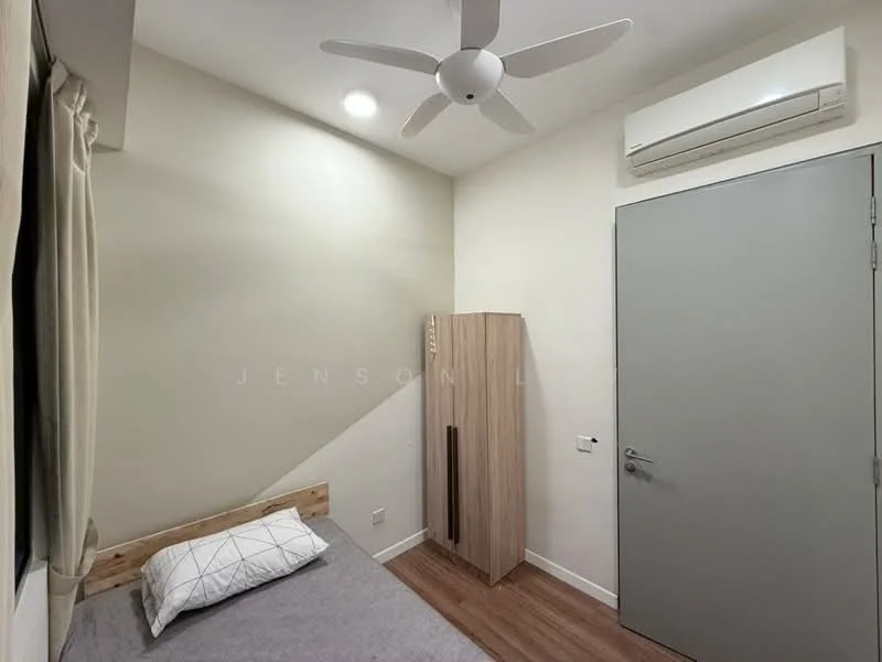 Bedroom features: single bed with grey bedding, wooden bed frame, light wood wardrobe, white painted walls, laminate flooring, ceiling fan, wall-mounted split AC, window with sheer curtains, light fixture, door with handle; style: modern.