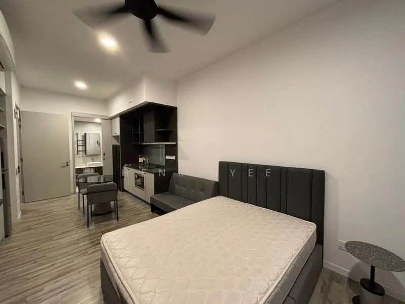 Room features: queen-size bed, upholstered headboard, grey fabric sofa, dining table for 4, kitchenette with cabinets, built-in microwave, stainless-steel sink, refrigerator, ceiling fan, wooden flooring, white painted walls, wall-mounted mirror, track lighting; style: modern.