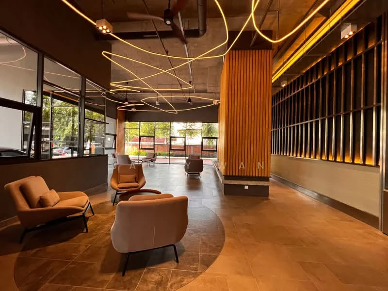 Room features: modern lounge area, two beige armchairs, concrete ceiling, exposed ductwork, decorative lighting with curved designs, large windows allowing natural light, wood paneling on one wall, tile flooring, ambient lighting along the wall; style: modern; view: garden.
