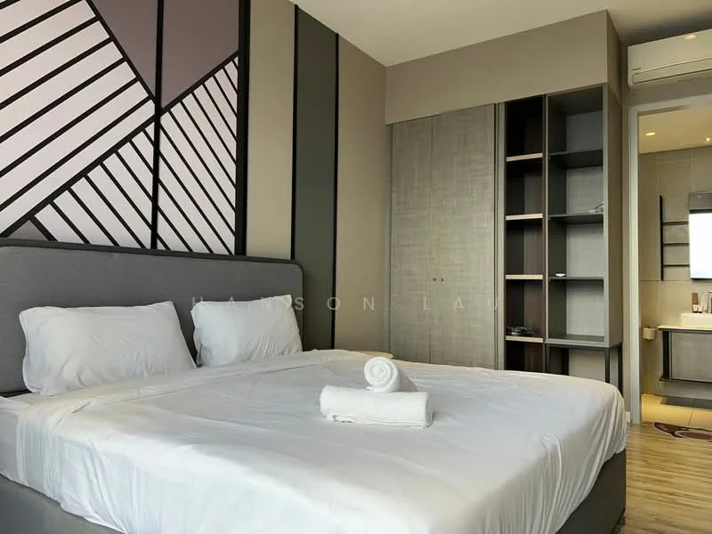 Bedroom features: king-size bed with grey upholstered headboard, white bedding, decorative towel rolled on bed, accent wall with geometric pattern in shades of grey and black, built-in wardrobe with sliding doors, open shelving unit, recessed lighting, floor-to-ceiling window, curtains, air conditioning unit; style: modern.
