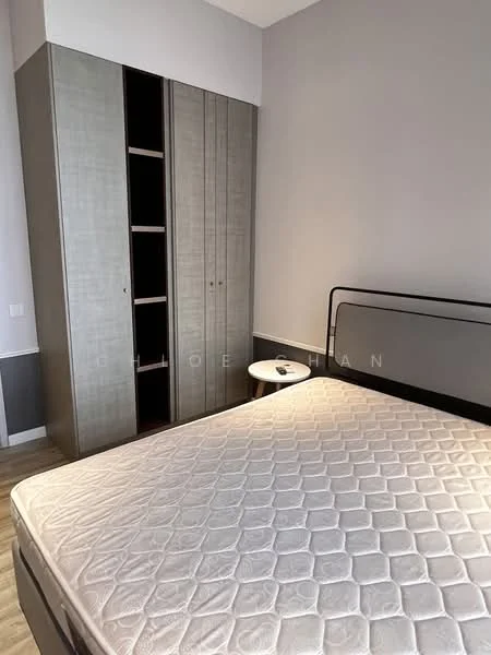 Bedroom features: queen-size bed frame without mattress, grey upholstered headboard, built-in wardrobe with sliding doors, light wood flooring, white walls, nightstand with drawer, minimalist decor, natural light from window; style: modern.