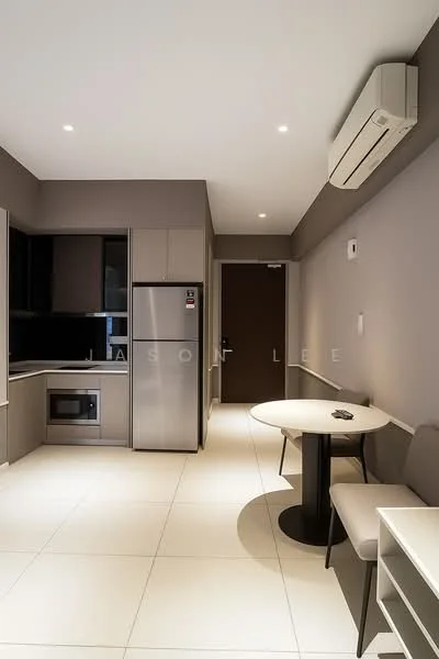 Kitchen features: grey painted walls, white tile flooring, recessed downlights, wall-mounted split AC, stainless-steel fridge, built-in microwave, black countertop, kitchen cabinets with flat-panel design, round dining table, upholstered dining chairs, open layout; style: modern.