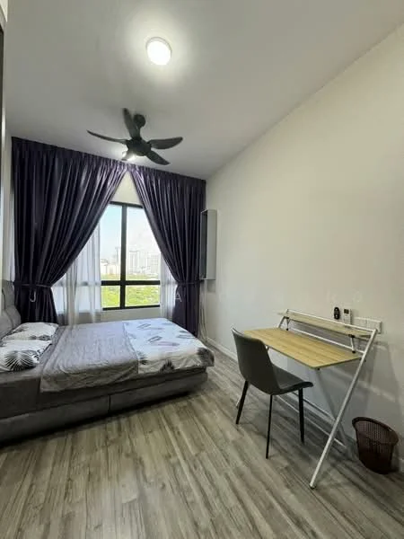 Bedroom features: queen-size bed with patterned bedding, floor-to-ceiling window with city view, dark purple curtains, 5-blade ceiling fan, wooden flooring, study desk with wooden top, grey chair, wall-mounted air conditioning unit, decorative wall art; style: modern; view: city.