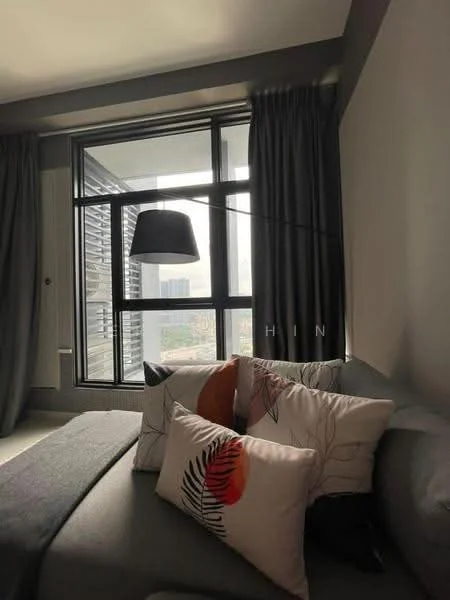 Room features: floor-to-ceiling windows, grey curtains, decorative throw pillows with floral pattern, light fixture with black shade, grey upholstered sofa, neutral wall color, city view, modern decor; style: modern; view: city.