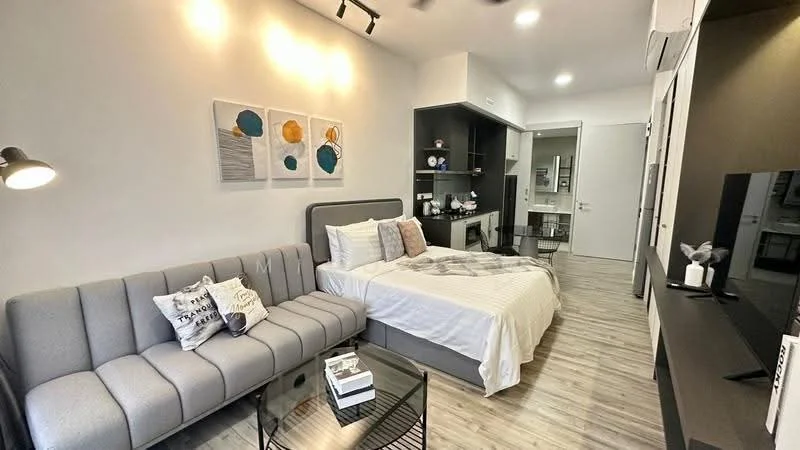 Bedroom features: grey fabric sofa, white bedding on bed, decorative pillows, wall-mounted TV, black TV console, light wood flooring, recessed ceiling lights, artwork on wall, built-in shelving unit, mirror on wall, white painted walls; style: modern.