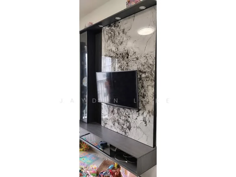 Living features: wall-mounted TV, black entertainment unit, marble accent wall, recessed lighting, open shelving, decorative items on shelves, colorful play mat on floor; style: modern.