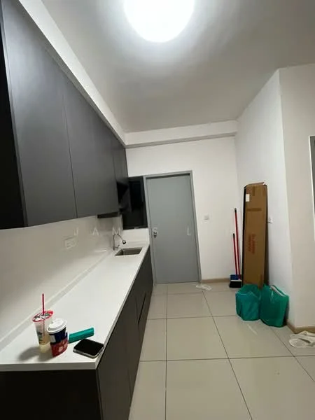 Room features: grey cabinetry, white countertop, tile flooring, recessed ceiling light, wall-mounted TV, door to another room, cleaning supplies, two takeaway cups, green bags, smartphone on countertop; style: modern.