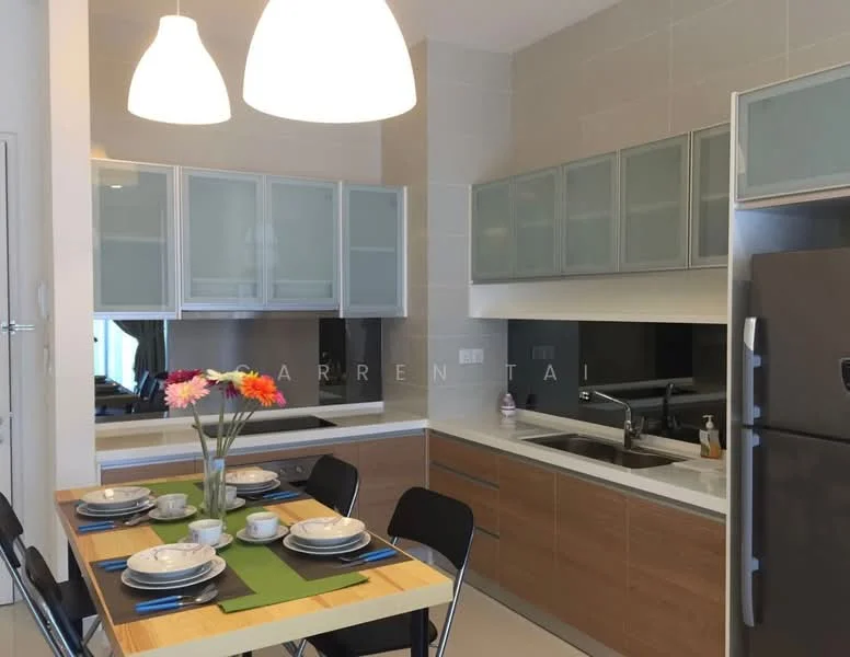 Kitchen features: white cabinets with glass fronts, brown wooden lower cabinets, double-bowl stainless-steel sink, chrome pull-down faucet, black countertop, built-in refrigerator, ceramic tile flooring, pendant lighting, dining table with place settings, black dining chairs, decorative flowers in vase; style: modern.