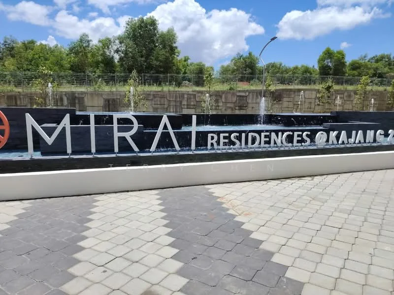 Exterior features: water feature with fountain, landscaped greenery, paved walkway, signage with 'MTRAI RESIDENCES', modern design elements, surrounding trees, concrete wall, lighting fixtures; style: modern.