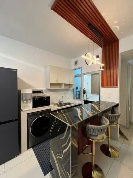 Kitchen features: black stainless-steel fridge, stainless-steel oven, stainless-steel microwave, double-bowl stainless-steel sink, chrome pull-down faucet, black and gold marble countertop, white cabinetry with flat-panel doors, wood accent wall with vertical slats, two bar stools with grey upholstery and gold legs, recessed downlights, white tiled flooring, backlit mirror; style: modern.