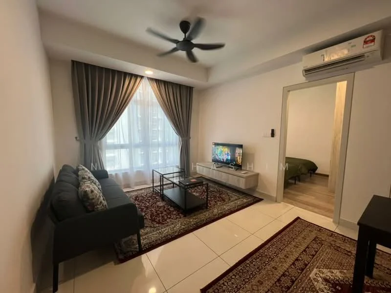 Living features: 3-seater fabric sofa in grey, decorative throw pillows, coffee table, wall-mounted TV, TV console, area rug with geometric pattern, 5-blade ceiling fan with light, floor-to-ceiling windows with sheer curtains, white painted walls, tile flooring, recessed downlights; style: modern. Room features: green bed visible in background, wooden flooring.
