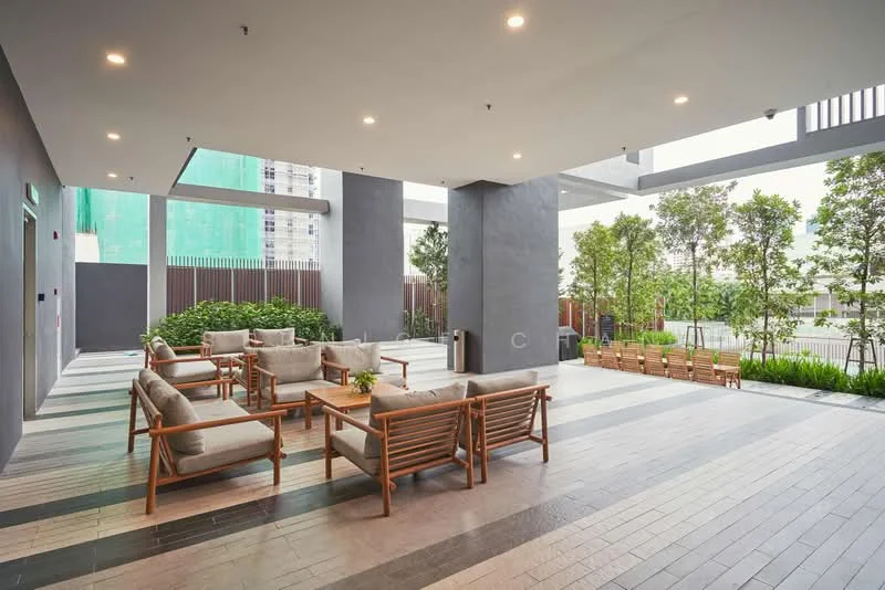 Exterior type: clubhouse; features: outdoor seating area with wooden chairs, grey tiled flooring, green landscaping with plants, concrete columns, overhead recessed lighting, open layout, wooden benches, surrounding greenery; style: modern.