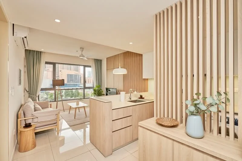 Living features: open-plan layout, light wood cabinetry, white quartz countertop, single-bowl stainless-steel sink, chrome pull-down faucet, pendant light, 5-blade ceiling fan, floor-to-ceiling windows, cream painted walls, tile flooring, sofa with light upholstery, coffee table, decorative plant, wall-mounted air conditioning unit, curtains; style: modern; view: city.