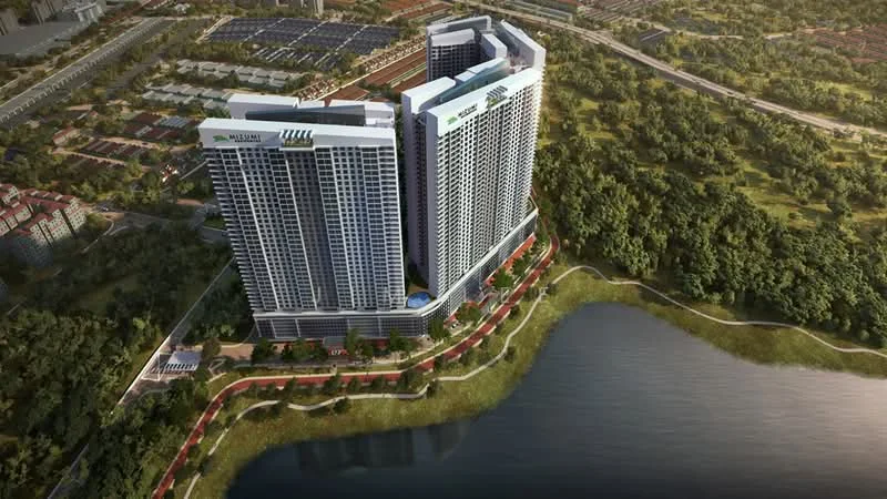 Exterior type: high-rise condominium; features: glass curtain wall, recessed balconies, surrounded by greenery, waterfront view, landscaped gardens, walking paths, parking area, multiple towers, swimming pool visible, outdoor amenities, urban context, proximity to main road; style: modern.