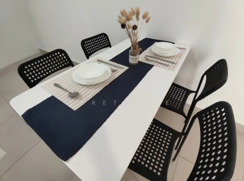 Dining features: white dining table, 4 black perforated dining chairs, navy blue table runner, 2 white plates, 2 silver forks, 2 silver knives, decorative vase with dried flowers, neutral wall color, tile flooring; style: modern.