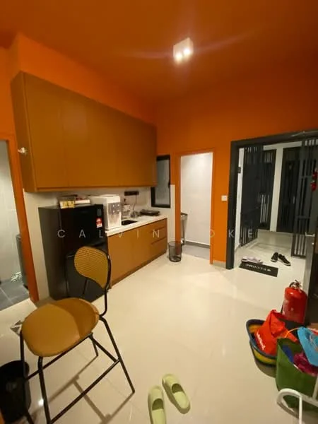 Kitchen features: orange painted walls, white tiled flooring, brown cabinetry, single-bowl stainless-steel sink, chrome pull-down faucet, built-in microwave, freestanding range oven, refrigerator, countertop space, waste bin, bar stool, open shelving, kitchen utensils, floor-mounted cabinet; style: modern. Room features: white walls, grey tiled flooring, doorway leading to another room, fire extinguisher, plastic storage bins.