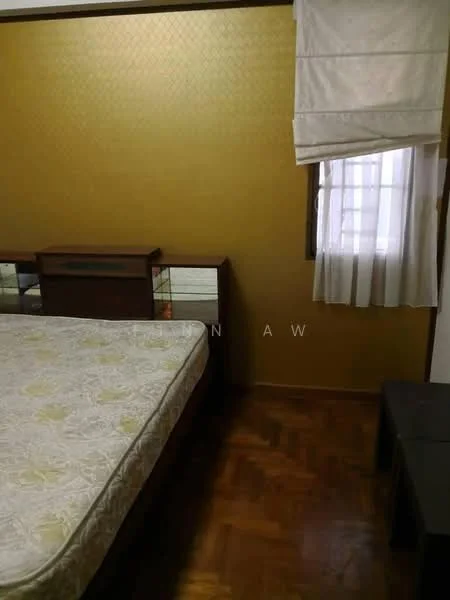 Bedroom features: queen-size bed, wooden bed frame, parquet wood flooring, gold painted accent wall, white curtains, window with sheer curtains, wooden dresser with mirror, side table, decorative wall paneling; style: traditional.