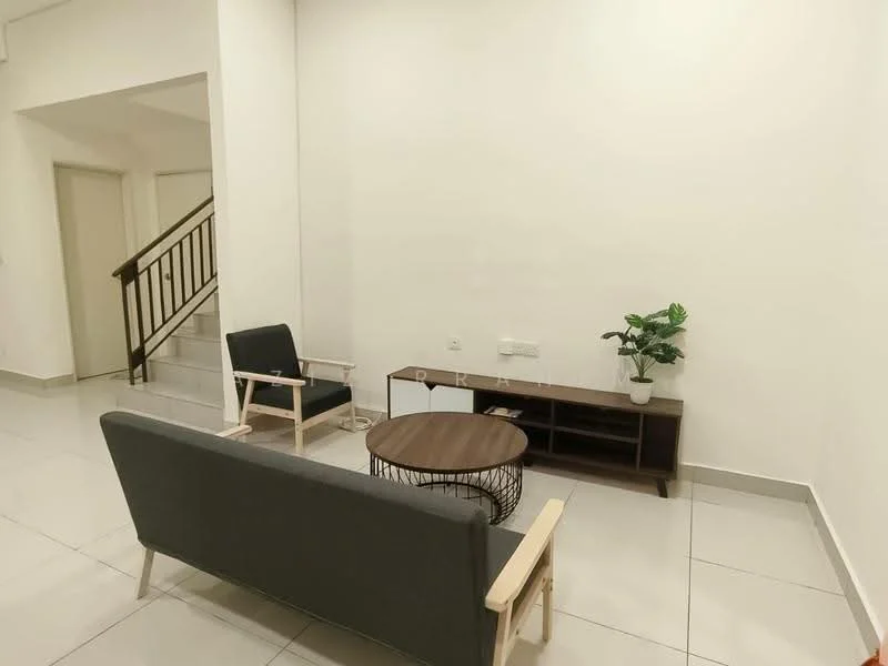 Living features: grey fabric sofa, wooden armchair with white frame, round wooden coffee table, TV console with storage, indoor plant in ceramic pot, white painted walls, glossy tile flooring, staircase in background; style: modern.