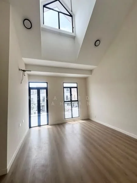 Living features: high ceiling, large floor-to-ceiling windows, two sliding glass doors, light wood flooring, white painted walls, recessed downlights, exposed beams, neutral color palette; style: modern.