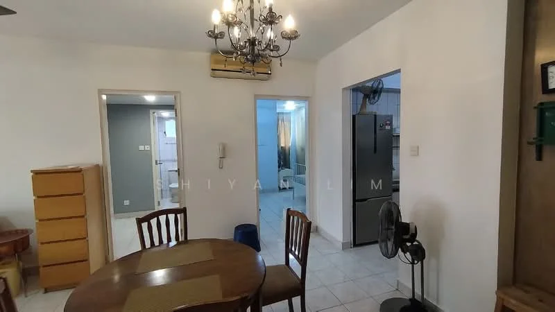 Dining features: round wooden dining table, 4 wooden dining chairs, chandelier with multiple bulbs, white painted walls, tile flooring, wall-mounted air conditioning unit, open doorway leading to kitchen, open doorway leading to hallway; style: modern. Kitchen features: stainless-steel fridge, wall-mounted fan, open layout to dining area; style: modern. Room features: tile flooring, white painted walls, open doorway leading to bathroom.