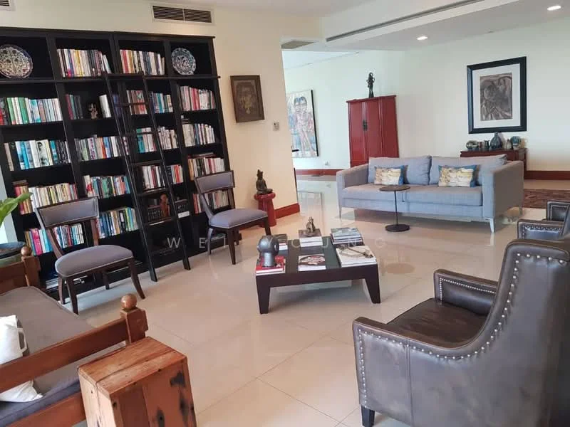 Living features: grey fabric sofa, wooden coffee table, 2 wooden chairs, bookshelf with numerous books, decorative sculptures, framed artwork on wall, cream tiled flooring, recessed ceiling lights, large windows with natural light, decorative wall clock; style: contemporary.