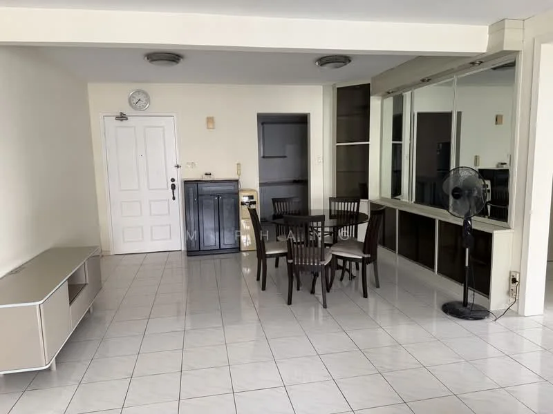 Living features: white painted walls, glossy white tile flooring, ceiling lights, wall-mounted clock, dining table with four chairs, sideboard cabinet, large mirror on wall, standing fan, door to hallway, built-in shelving unit; style: modern.