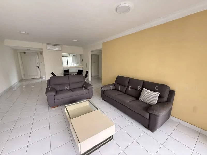Living features: two grey fabric sofas, coffee table with cream top, white tiled flooring, cream painted walls, crown moulding, wall-mounted air conditioning unit, recessed ceiling lights; style: modern.